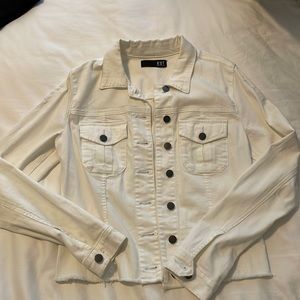 White jean jacket with some distressed rips